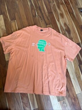 Brain Dead Peach Tee with Green Brain Graphic